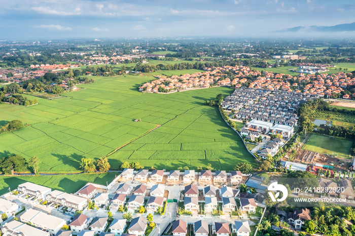 Land or landscape of green field in aerial view. Include agriculture farm, house building, village. 