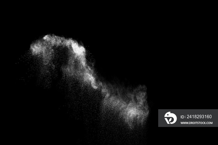 White powder explosion cloud against black background.White dust particles splash.