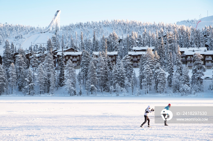 Healthy lifestyle. Winter sport skiing. Winter lake in Kuusamo Ruka. Finland.