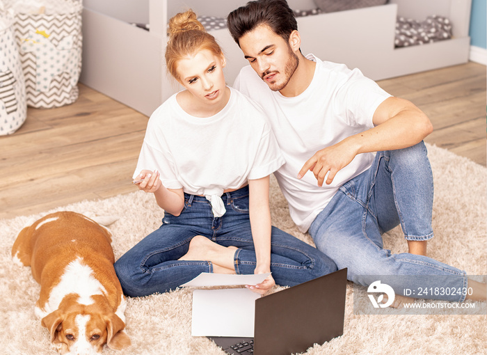 Young couple in childrens room.