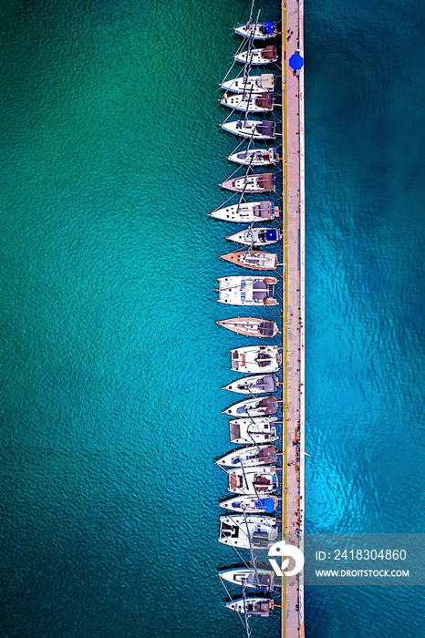 Yachts anchored to  Kordoni , the long pier at the port of Volos town, Magnissia, Thessaly, Greece.