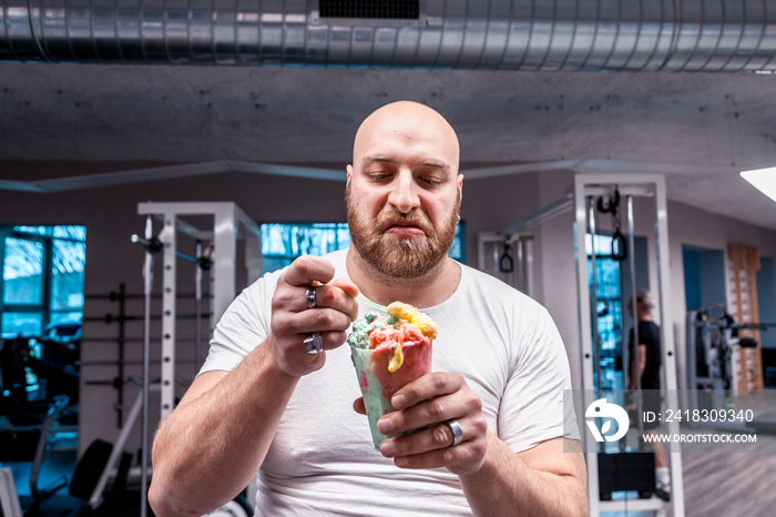 portrait of athlete while eating an ice cream on break