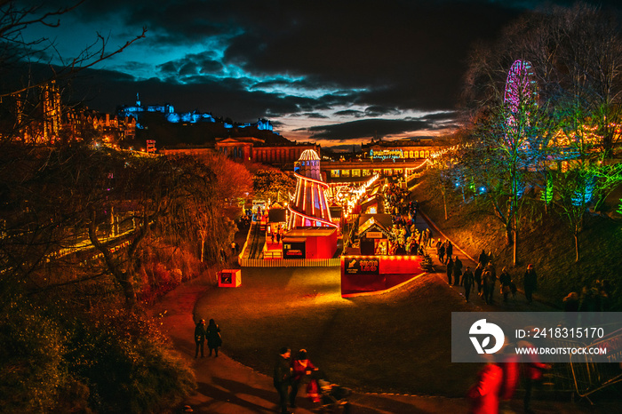 Edinburgh Christmas Market at Night cityscape nigh lights Edinburgh skyline with Edinburgh Castle an