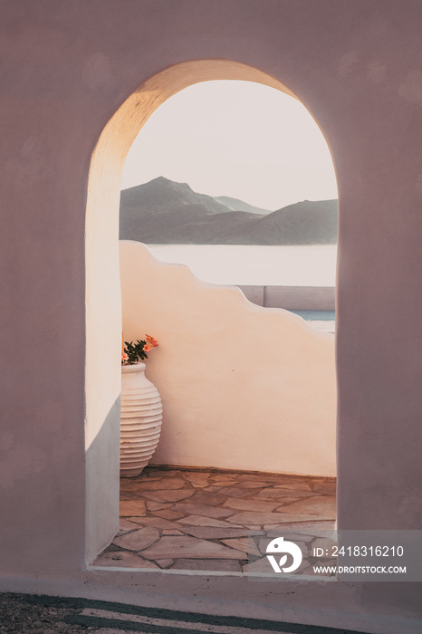 traditional Greek door opening to the sea