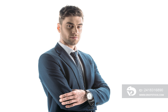 good-looking, confident businessman with crossed arms looking at camera isolated on white