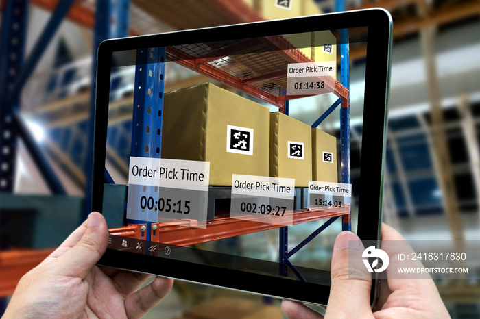 Industrial 4.0 , Augmented reality and smart logistic concept. Hand holding tablet with AR applicati