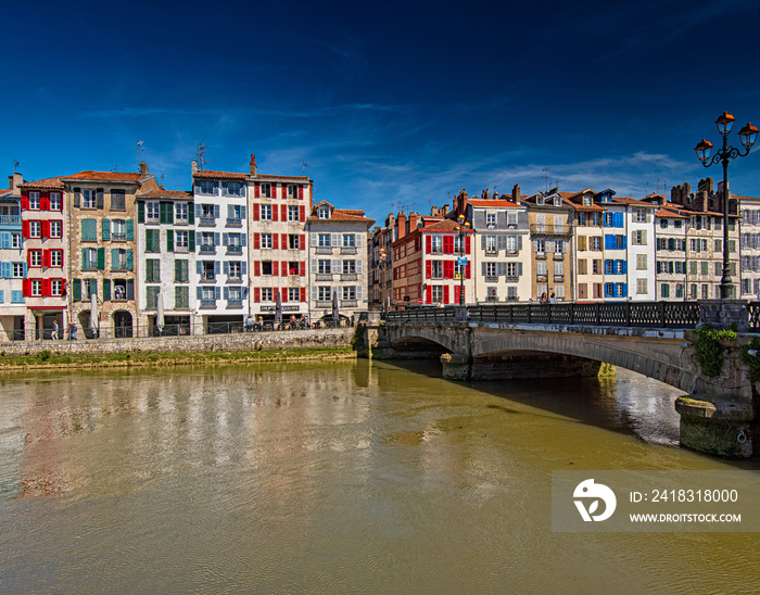 Colorful houses at the Nive river embankment in Bayonne, France