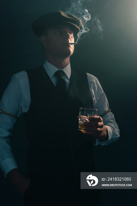Retro businessman with cap smokes cigarette in smoky room.