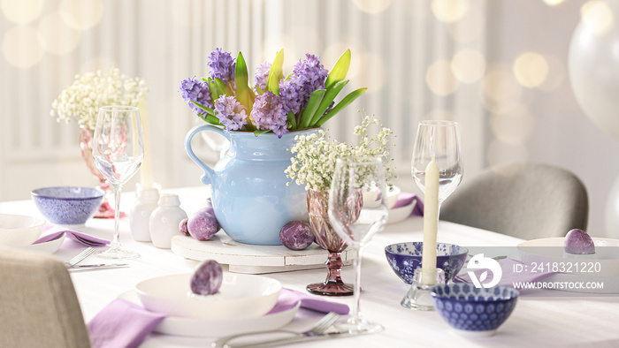 Beautiful table setting with spring flowers for Easter celebration