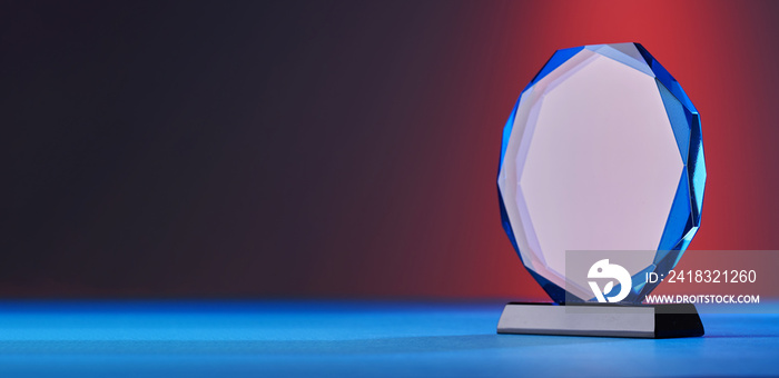 close up of crystal trophy on colored background