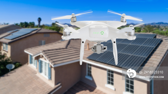 UAV Drone Inspecting Solar Panels On Large House