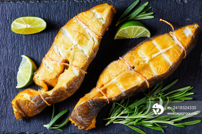 Traditional smoked halibut fish steaks with lime