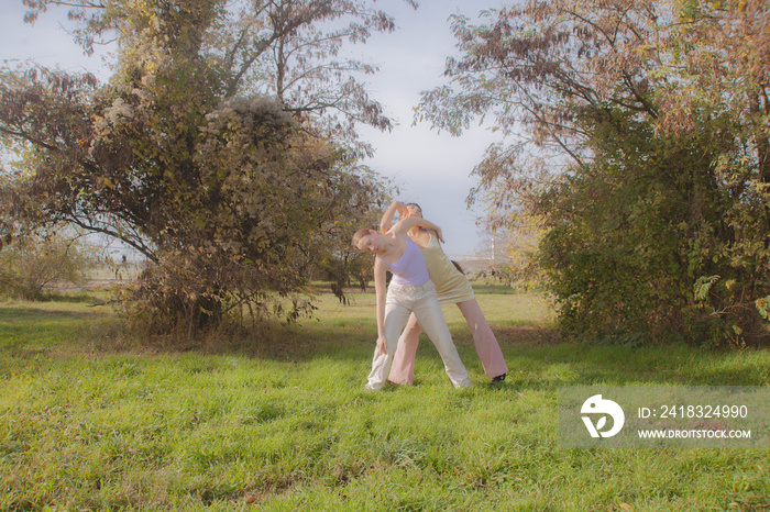 women in nature dancing