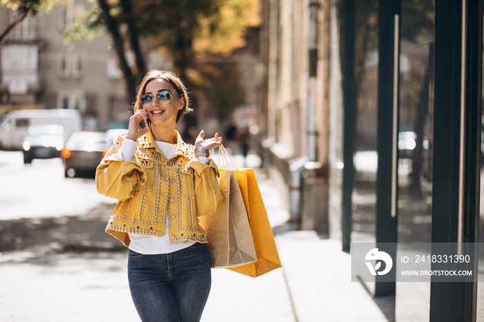 Young woman with shopping bags in the city