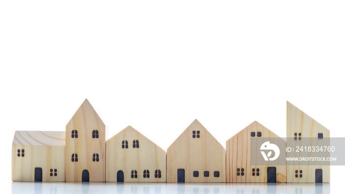 Wooden block house model building blocks arranged in row on white background.