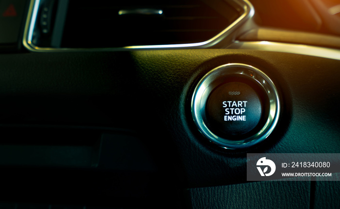 Start stop engine button of luxury car. Push up button for start or stop car engine in keyless autom