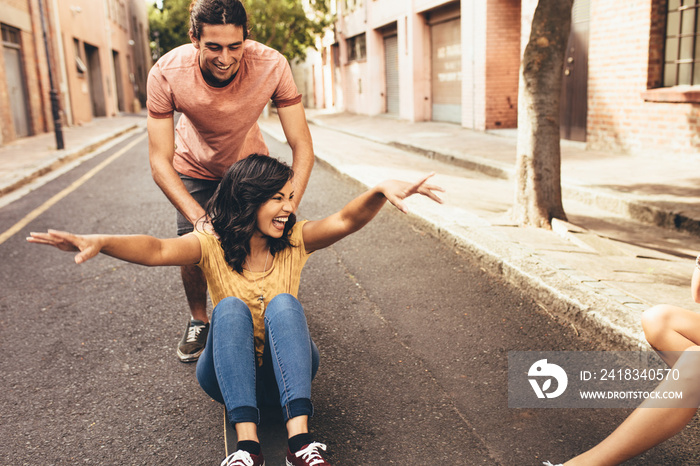 Couple having fun with skateboard