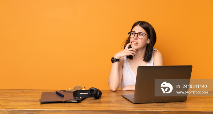 Business woman in a office with confuse face expression