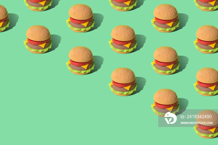 淡绿色背景上的快餐汉堡图案是最具创意的垃圾食品概念。