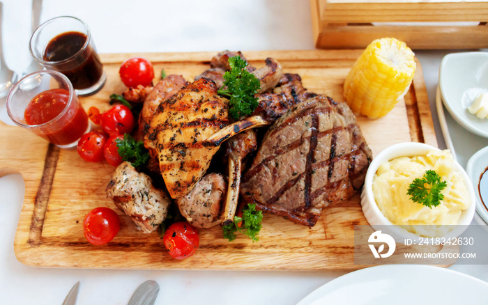 mixed meat steak on wooden plate