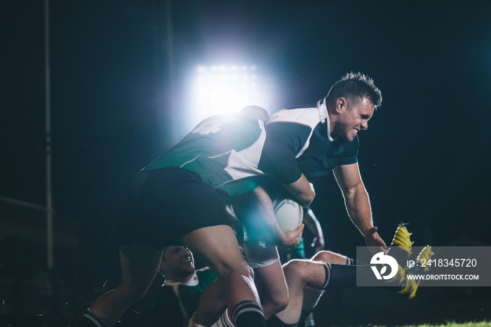 Rugby players blocking the opponent