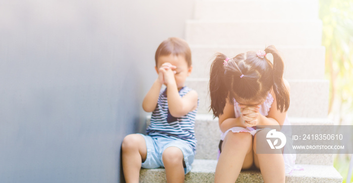 Little sister praying with her baby brother.Prayer kids pray for GOD help.Christian little girl and 