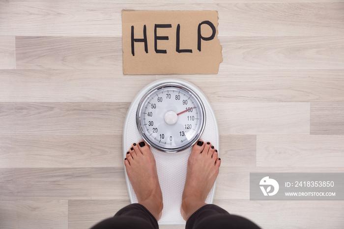 Help Sign With Womans Feet On Weighing Scale