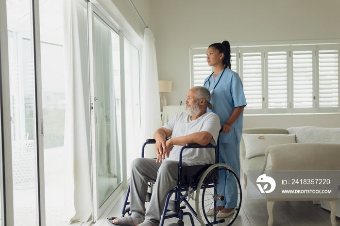 Healthcare worker and man on wheelchair