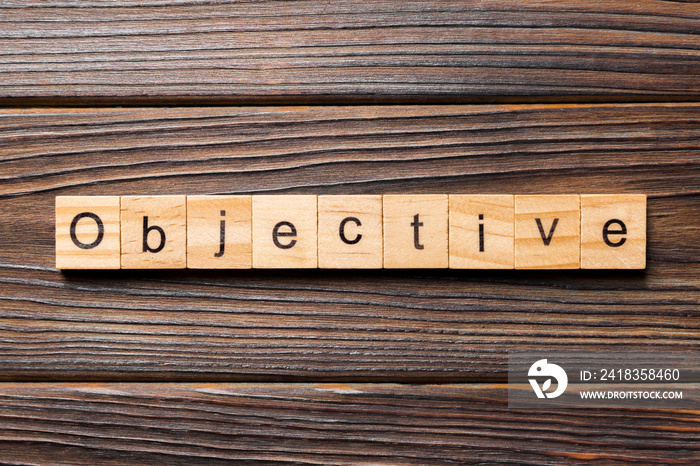 objective word written on wood block. objective text on table, concept