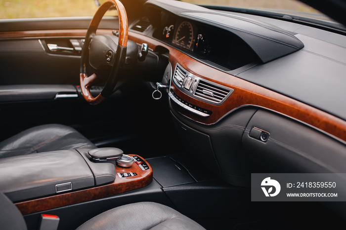 Luxury premium car interior with leather seats and modern technology.