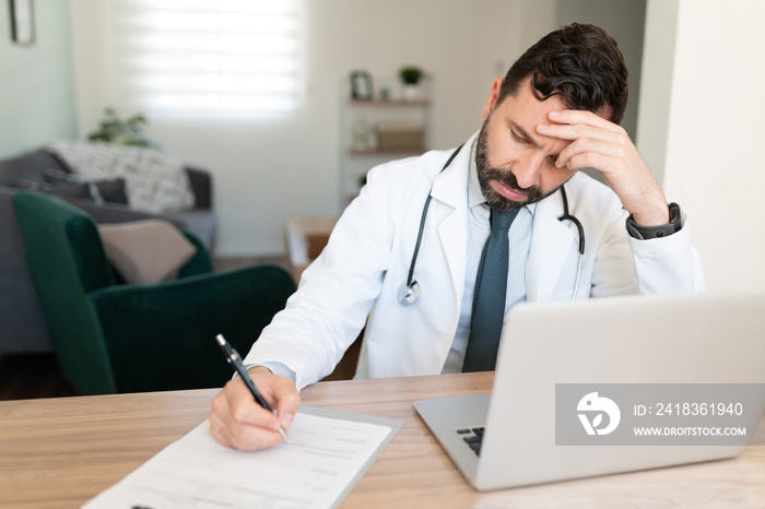 Stressed doctor working from home