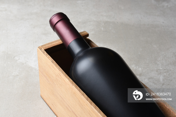 Wine Bottle Still Life: Closeup of a Wine Bottle in a Wood Box