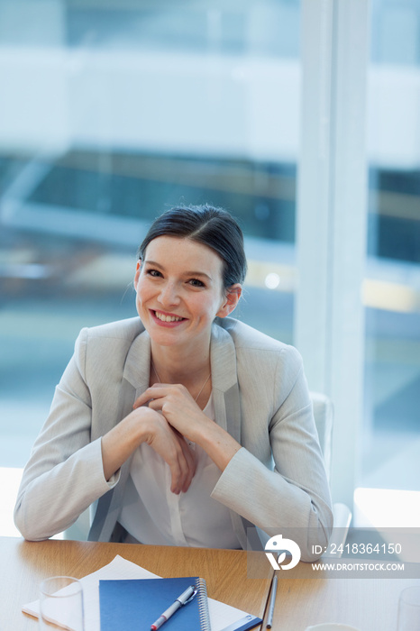 Portrait confident young corporate businesswoman in office