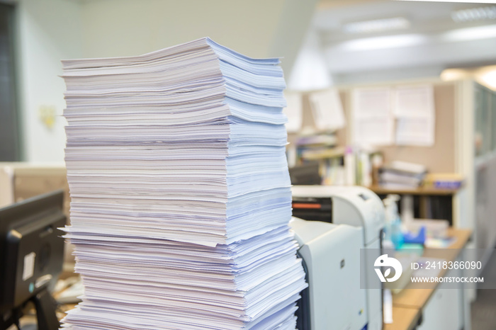 Pile of a lots reuse paper and paperwork report or printout document on desk office stack up for wor