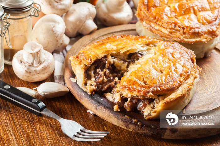 Fresh beef stew pie on a cutting board