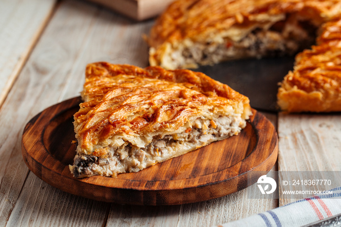 Cut pie with beef and pumpkin filling