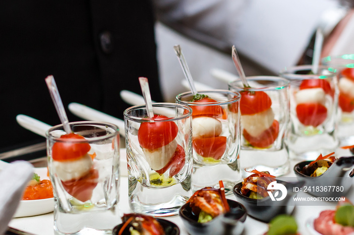 Server holding a tray of appetizers at a banquet