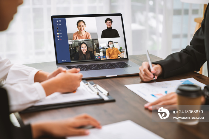 Business people using laptop on table with making video call meeting to team online and present work