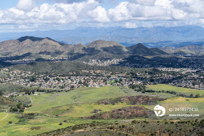 Mountaintop view of nature park meadows and suburban homes in scenic Newbury Park near Los Angeles, 