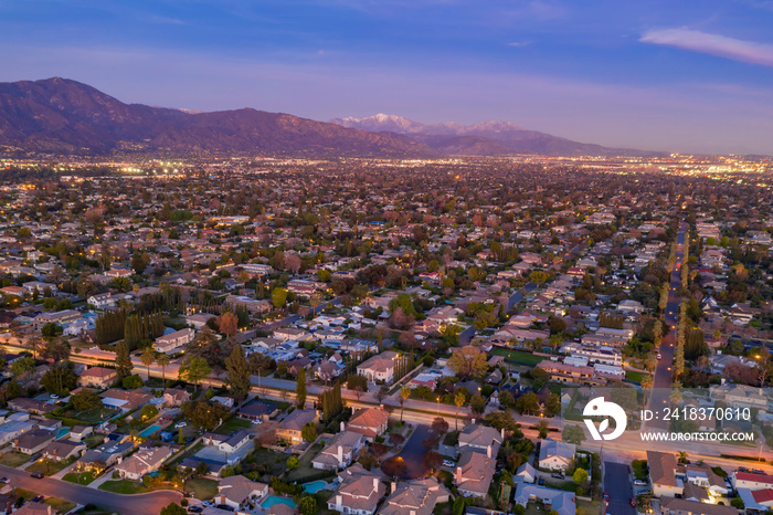 Aerial night view of the  Arcadia area with the white snowy Mt. Baldy