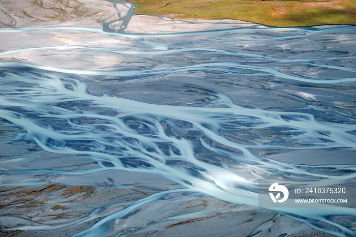 New Zealand. Mountain rivers on the plain flow into many streams