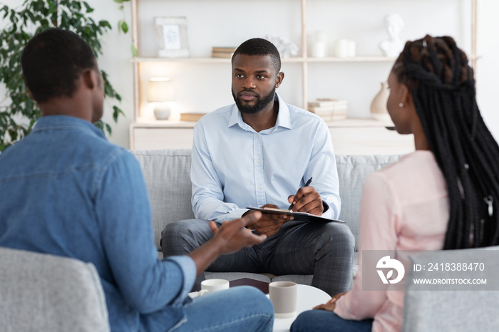 Professional Marital Therapist Having Session With Young Black Spouses, Selective Focus