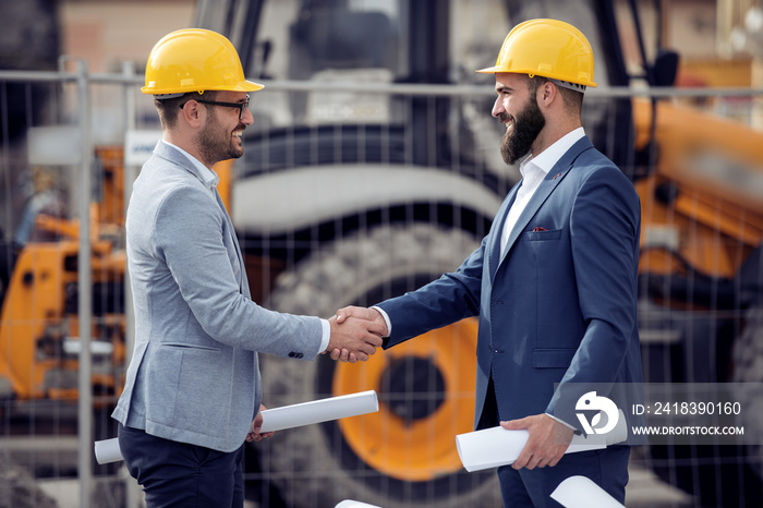 Two engineers shaking hands