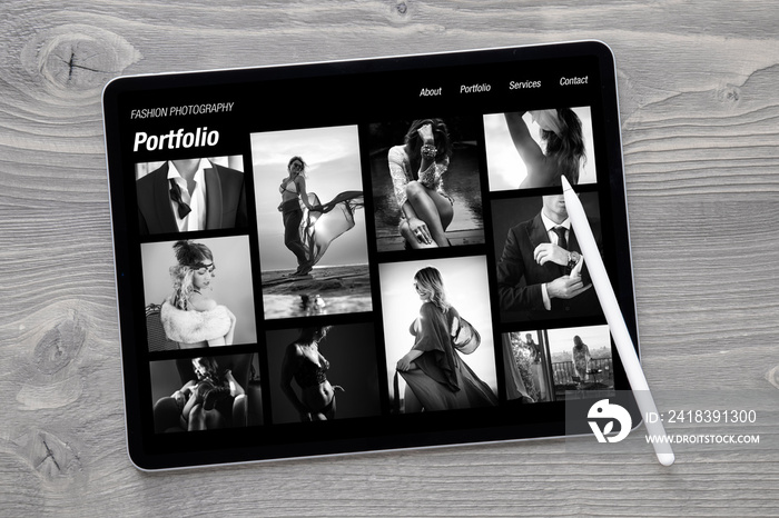 Sample black and white fashion photography portfolio website on tablet computer