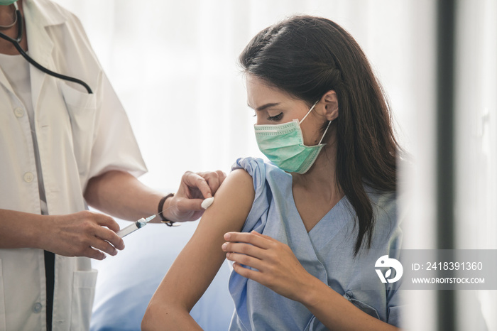 Doctor giving patient vaccine, flu or influenza shot or taking blood test with needle. Nurse with in