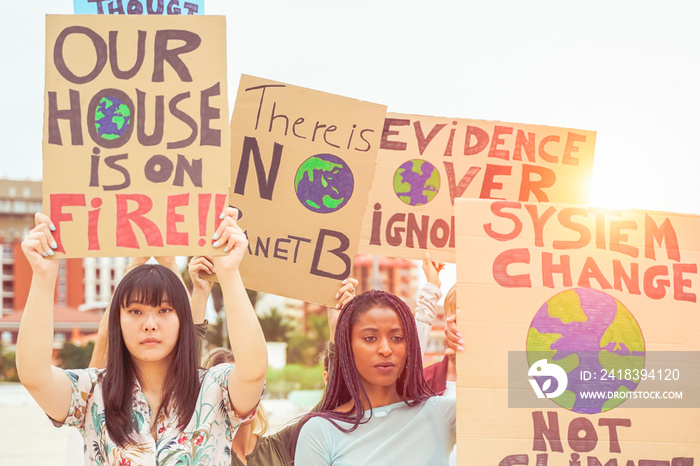 People protesting against climate change opinion. Young people from different countries showing thei