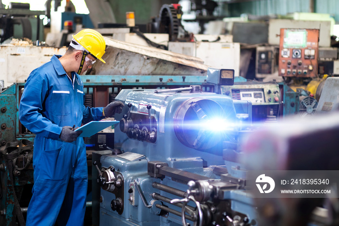 Mechanical Engineering control lathe machine in factory facility. Safety First at work place.