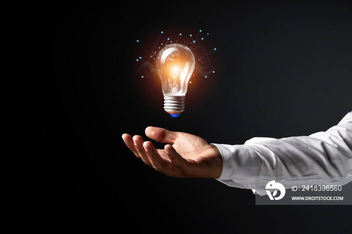 Man holding light bulbs, ideas of new ideas with innovative technology and creativity.