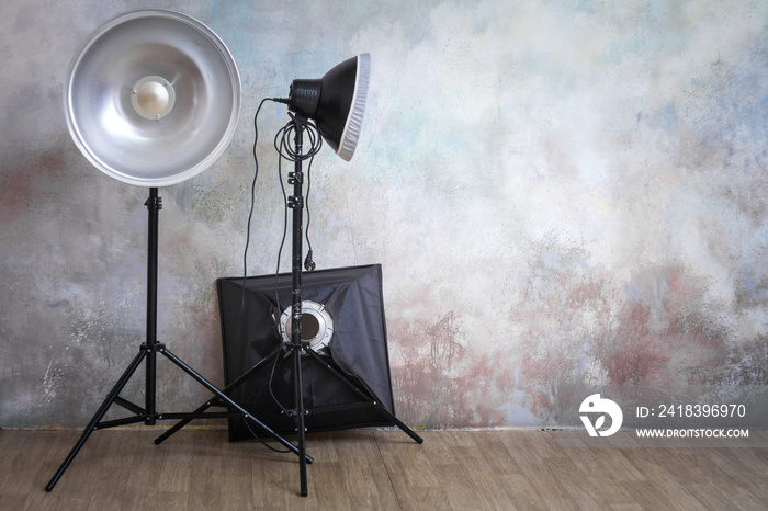 Professional lighting equipment in the photo studio on the original gray background