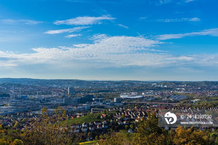 Germany, Stuttgart city  skyline, industry, arena and houses in valley, aerial view above cityscape 